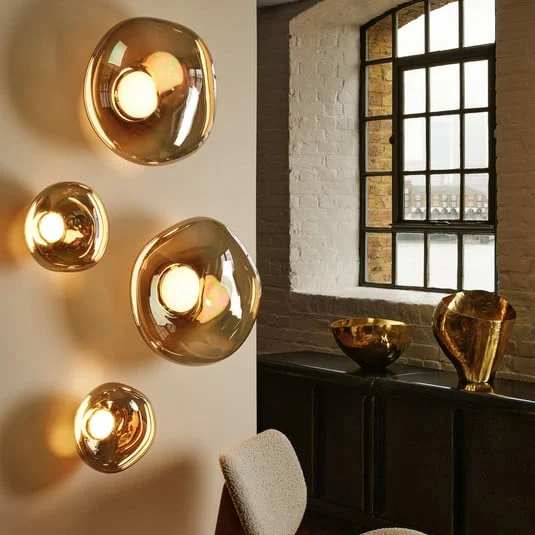 Aplique de pared LED Melt de Tom Dixon, Ø 29 cm, color bronce