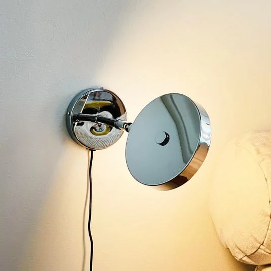 Aplique de pared LED Starlight de Dyberg Larsen, cromado, Ø 14 cm, atenuable.