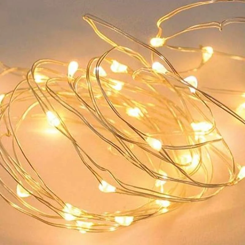 Cordón 50 LED grano de arroz funcionamiento a pilas luz cálida